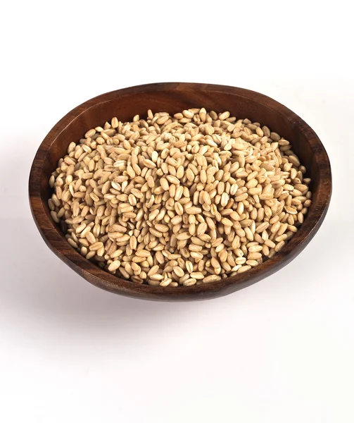 stock image Wheat grain in a bowl on white