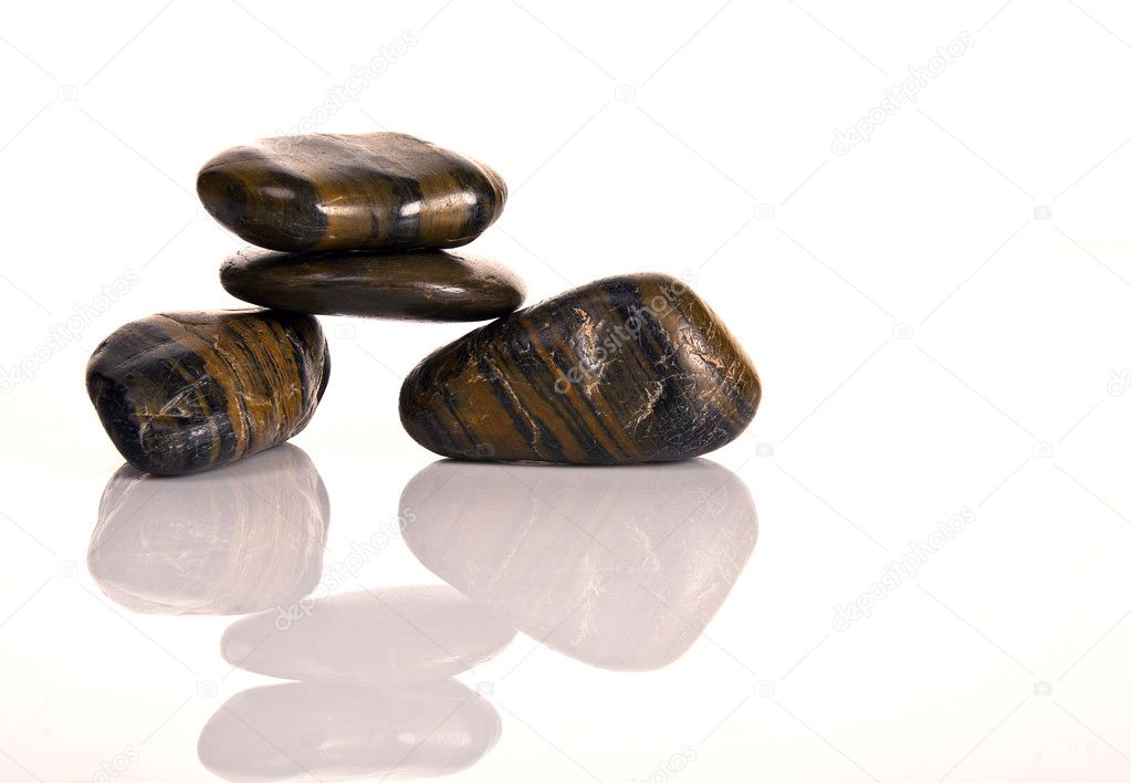 FIVE STACKED BROWN SPA PEBBLES