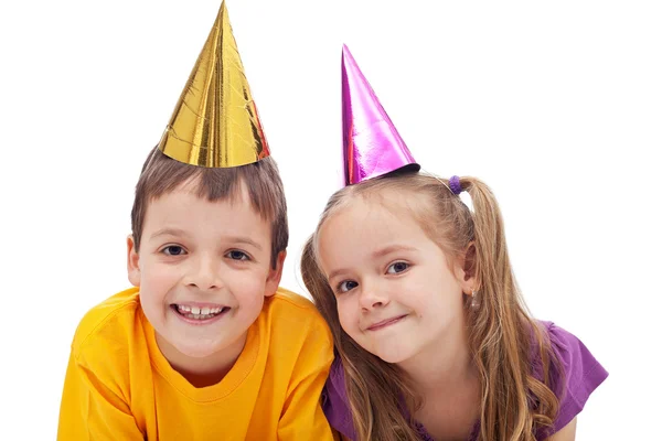 Happy kids with party hats Royalty Free Stock Images