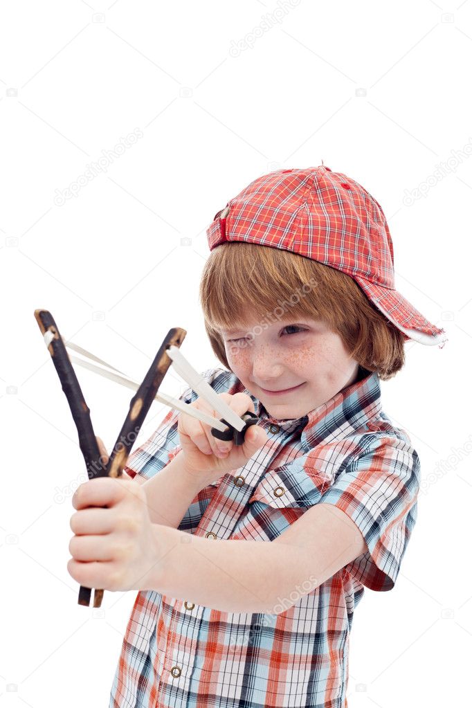 Mischievous kid aiming with sling