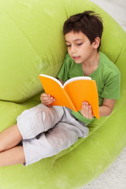 Boy practice reading clipart