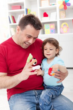 Toddler boy playing with his father clipart