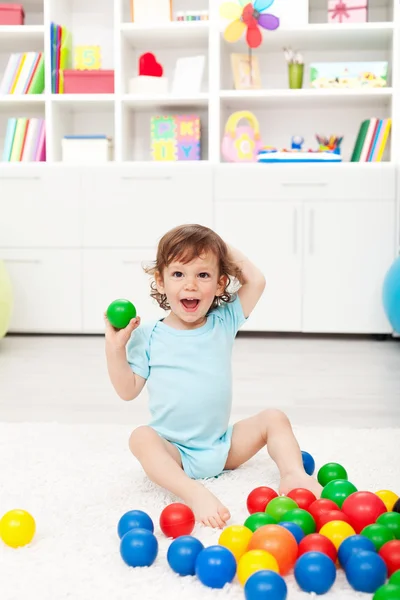 stock image Happy toddler with balls