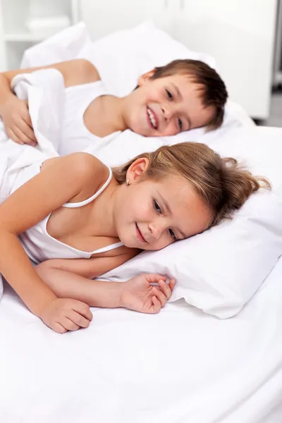 Happy morning lazing kids — Stock Photo, Image