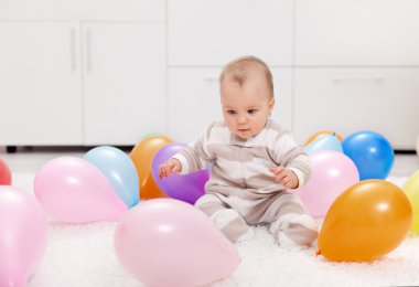 Baby girl with balloons clipart