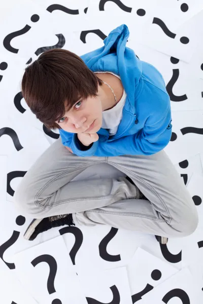 Young teenager boy with lots of questions — Stock Photo, Image