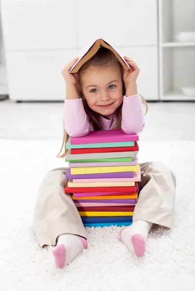 Little girl with books Royalty Free Stock Photos