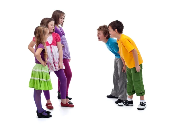 Group of boys and girls mocking each other — Stock Photo, Image