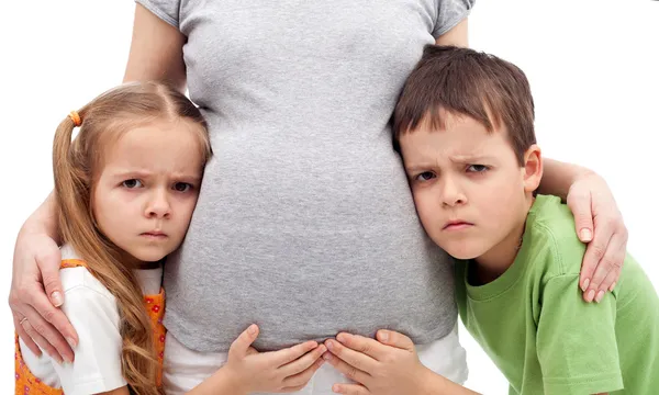 Grumpy kids not happy about their new sibling — Stock Photo, Image