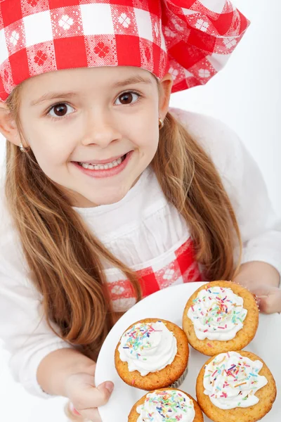 Happy little chef proud of her muffins — Stock Photo, Image