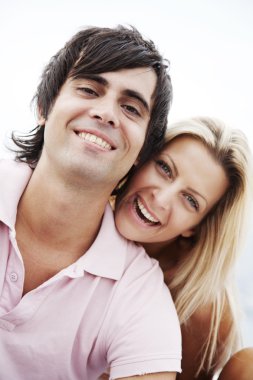 Couple smiling at camera clipart