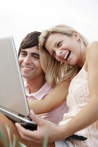 stock image Happy couple with laptop