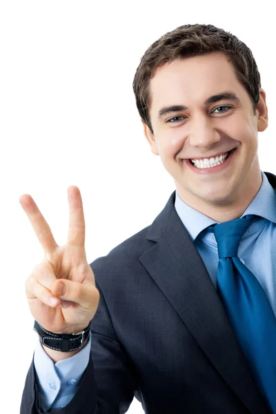Podnikatel ukazující dva prsty nebo znak vítězství — Stock fotografie