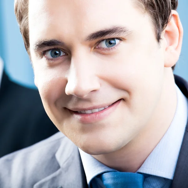 Portrait of smiling businessman at office — Stock Photo, Image