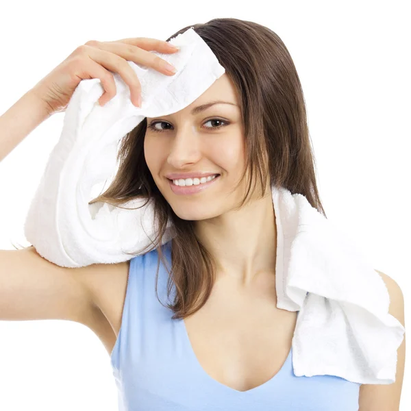 Frau in Fitnessbekleidung mit Handtuch, auf weiß — Stockfoto