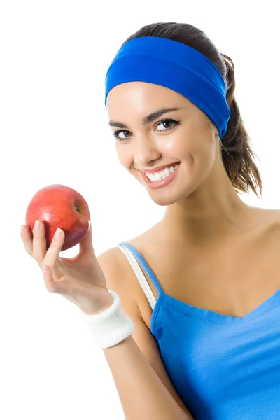 Frau im Fitnessanzug mit Apfel, isoliert — Stockfoto
