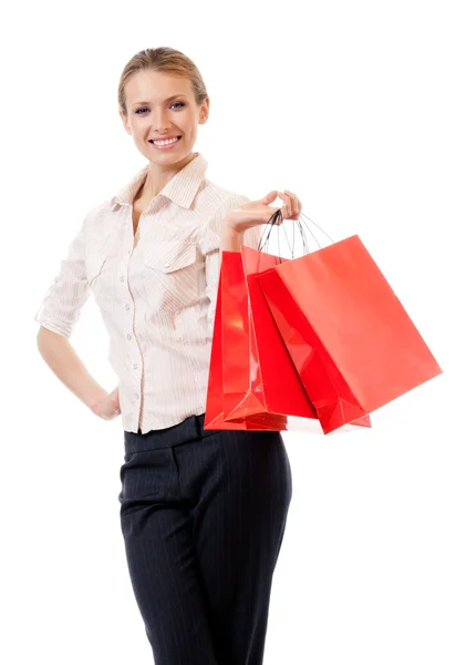 Young happy woman with shopping bags, isolated — Stock Photo, Image
