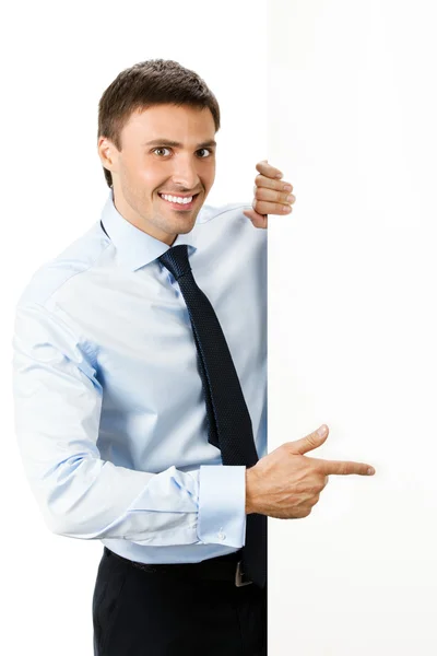 Бізнесмен, що показує вивіску, на білому — стокове фото