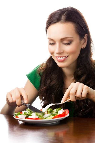 Молодая женщина с салатом, на белом — стоковое фото