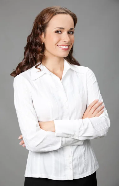 Mulher de negócios sorridente, sobre cinza — Fotografia de Stock