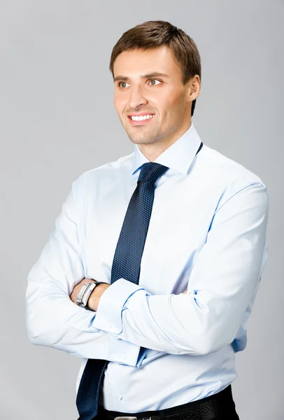 Businessman, isolated on grey — Stock Photo, Image