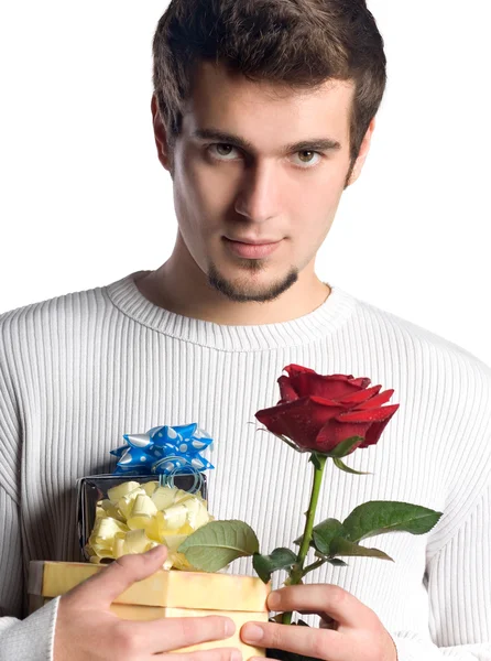 stock image Young man with gifts and rose