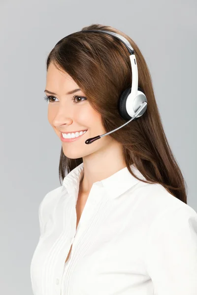 Support telefon operatör i headset, på grå — Stockfoto