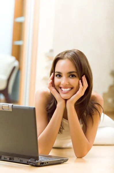 Woman working with laptop, at home Royalty Free Stock Photos