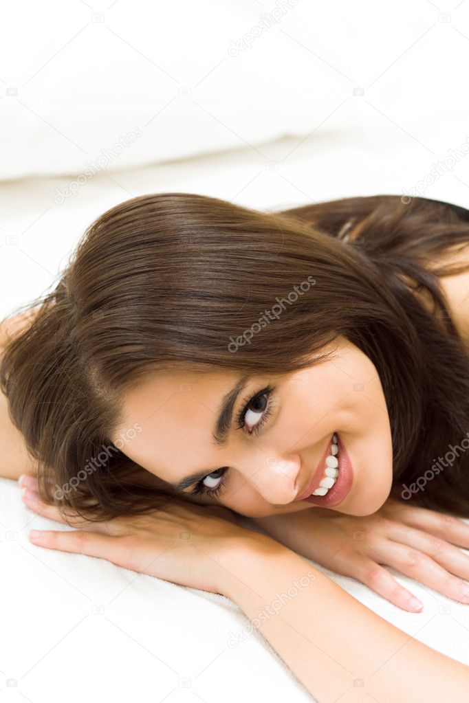 Happy woman waking up at home