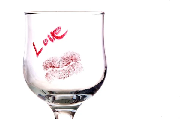 Glass with notice and kiss — Stock Photo, Image