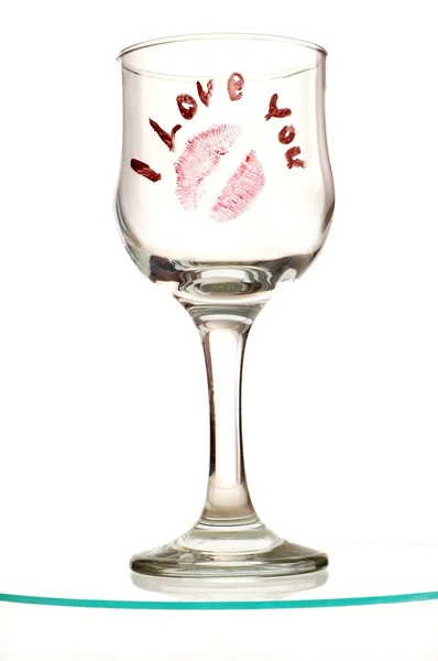 Glas met voorafgaande kennisgeving en kus — Stockfoto