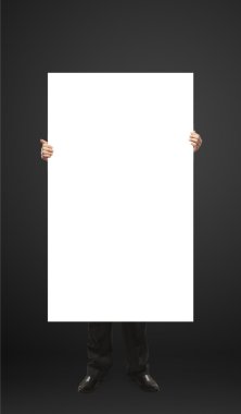 Businessman holding a blank white board. clipart