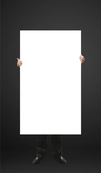 Businessman holding a blank white board. — Stock Photo, Image