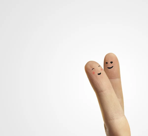 Paar umarmt glückliche Finger Smileys mit Liebe. — Stockfoto