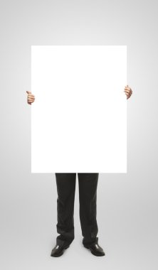 Businessman holding a blank white board. clipart