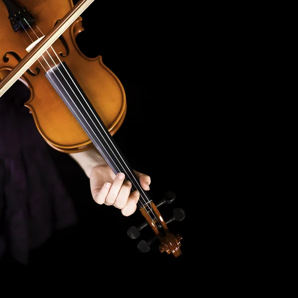 Young girl practicing the violin. Over black background. — Stock Photo, Image