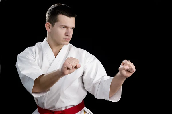 Contrast karate jonge vechter op zwart — Stockfoto