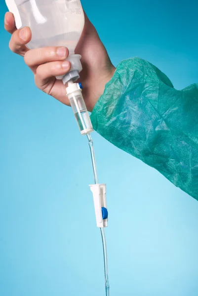 Hand holding infusion bottle — 스톡 사진