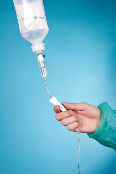 Hand and infusion bottle 스톡 사진