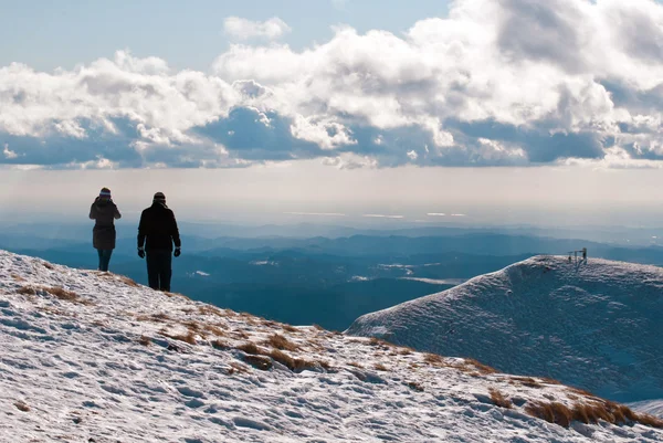 stock image Couple on top of the mountain