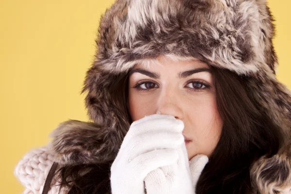 Woman keeping warm. Stock Picture
