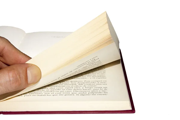 Hand med bladen av boken — Stockfoto