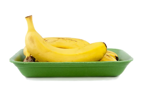 Bananas into the pan with white background — Stock Photo, Image