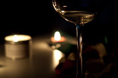 Glass of vine and candles clipart