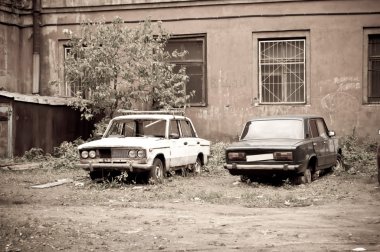 Two broken half-rotten old cars clipart