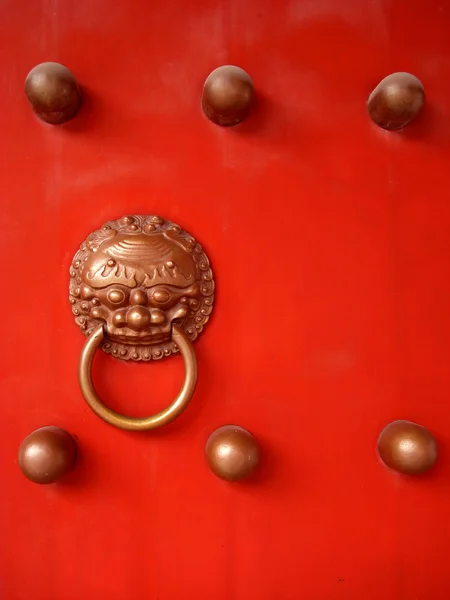 stock image Red door with lion's head