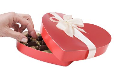 Woman's hand taking chocolate candy clipart