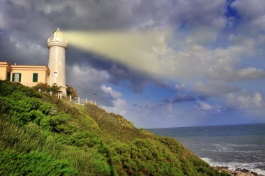 Lighthouse lights the sea clipart