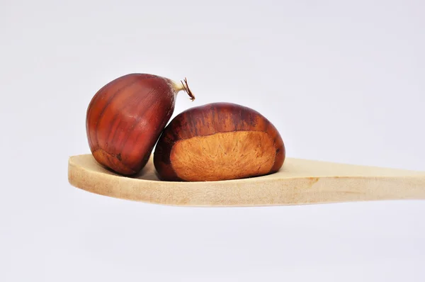 Spoon with chestnuts — Stock Photo, Image