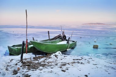 Boats on frozen lake clipart